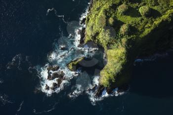 Royalty Free Photo of an Aerial of a Rocky Coast on Pacific Ocean in Maui, Hawaii