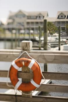 Royalty Free Photo of a Life Preserver Hanging on a Dock in Bald Head Island, North Carolina