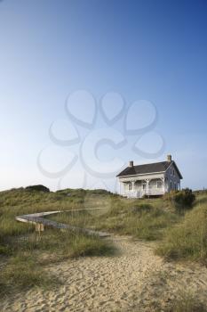Royalty Free Photo of a Coastal House With Pathway to Beach on Bald Head Island, North Carolina