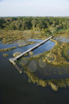 Royalty Free Photo of an Aerial View of a Dock and Boardwalk Over a Marsh Bald Head Island, North Carolina