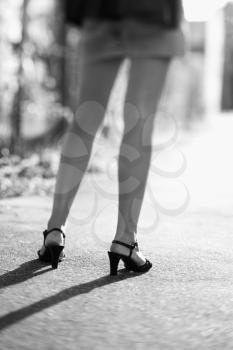 Royalty Free Photo of a Woman's Legs Wearing High Heels