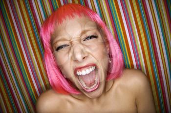 Royalty Free Photo of a Woman in a Pink Wig Screaming
