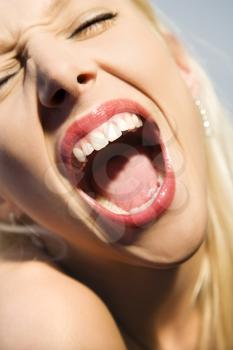 Royalty Free Photo of a Blonde Woman Screaming