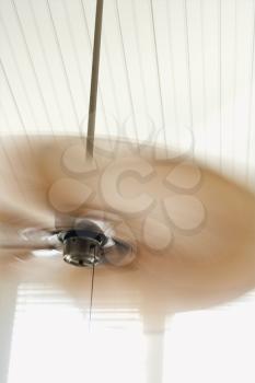 Royalty Free Photo of a Ceiling Fan With Motion Blur