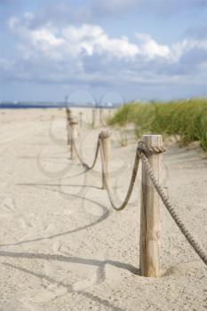 Royalty Free Photo of a Rope Fence Barrier on a Beach
