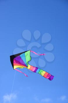 Royalty Free Photo of a Colorful Kite Flying in The Sky