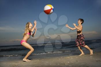 Royalty Free Photo of a Boy and Girl Playing on the Beach