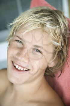 Royalty Free Photo of a Teenage Blond Boy Smiling