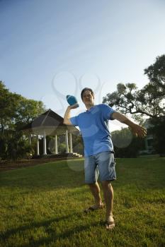 Royalty Free Photo of a Man Throwing a Football