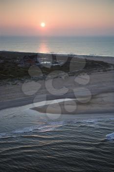 Scenic aerial view of Baldhead Island, North Carolina beach at dusk.