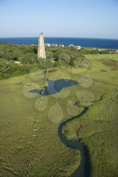 Royalty Free Photo of Old Baldy Lighthouse in Marshy Lowlands of Bald Head Island, North Carolina
