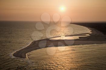 Royalty Free Photo of an Aerial View of the Sun Over the Atlantic Ocean and Shoreline of Bald Head Island, North Carolina