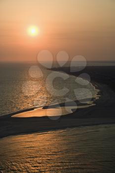 Royalty Free Photo of a Sunset Over the Atlantic Ocean and Shoreline of Bald Head Island, North Carolina