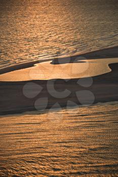 Royalty Free Photo of Sun Setting Atlantic Ocean and Shoreline of Bald Head Island, North Carolina