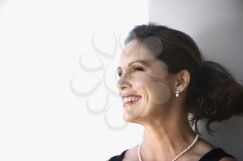 Royalty Free Photo of a Woman Smiling and Looking to the Side