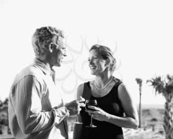 Royalty Free Photo of a Couple Drinking Wine and Smiling
