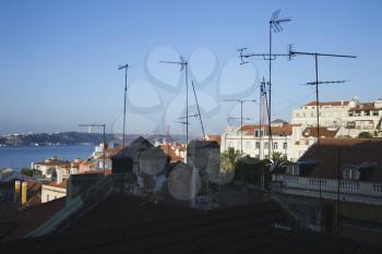 Royalty Free Photo of an Urban rooftop scene with many antennas in Lisbon, Portugal