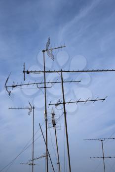 Royalty Free Photo of Antennas Against a Blue Sky
