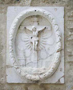Royalty Free Photo of a Relief Sculpture of Crucifixion in Lisbon, Portugal