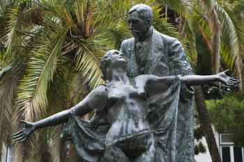 Royalty Free Photo of a Statue of a Novelist Eca de Queiros With Female Muse in Lisbon, Portugal