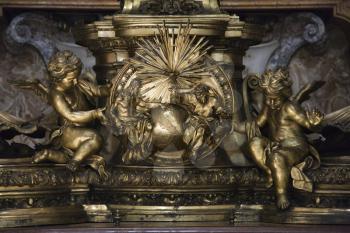 Royalty Free Photo of a Sculpture of Cherubs and Creation in Saint Peter's Basilica, Rome, Italy