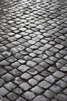 Royalty Free Photo of a Close-up of a Cobblestone Street in Rome, Italy