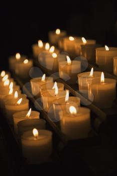 Royalty Free Photo of a Group of Lit Candles in Rome, Italy