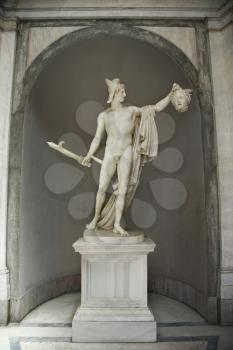 Royalty Free Photo of a Sculpture of Perseus Holding the Head of the Gorgon Medusa in Vatican Museum in Rome Italy
