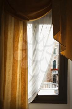 Royalty Free Photo of a Window With Drapes in Venice, Italy