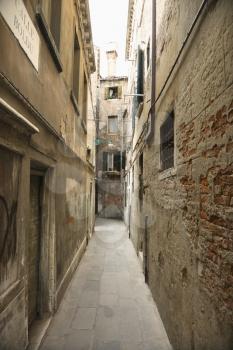 Royalty Free Photo of an Alleyway Between Buildings in Venice, Italy