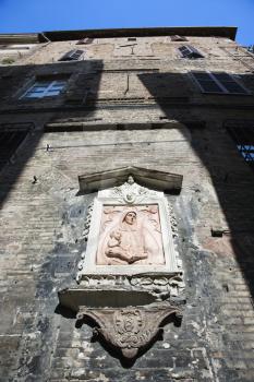 Royalty Free Photo of an Outdoor Relief of Virgin and Child, Italy