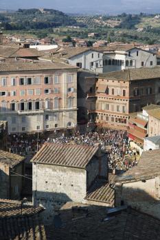 Royalty Free Photo of a Rooftop View of Piazza del Campo With a Crowd Gathered