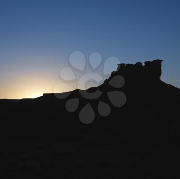 Royalty Free Photo of a Silhouette of Garden of the Gods Rock Formation at Dusk in Monument Valley, Utah