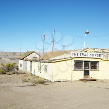 Royalty Free Photo of an Old Trading Post in a Desert Landscape of Utah