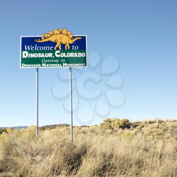 Royalty Free Photo of a Welcome Sign for City of Dinosaur, Colorado, USA