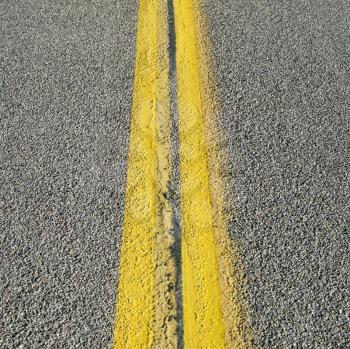 Royalty Free Photo of a Close-up of Double Yellow Lines on a Road