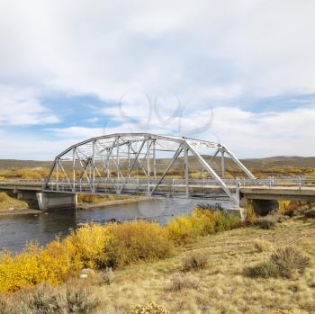 Royalty Free Photo of a Bridge Over a Stream in Wyoming