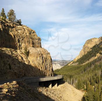 Royalty Free Photo of a Highway Winding Through Steep Wyoming Mountains