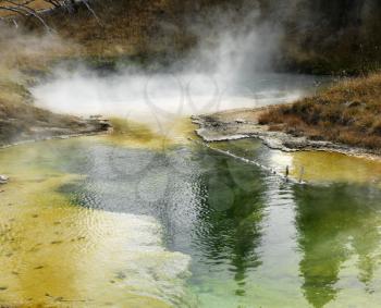 Colorful mineral deposits in geyser basin at Yellowstone National Park, Wyoming.