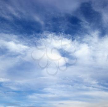 Royalty Free Photo of Wispy Cloud Formations Against a Clear Blue Sky
