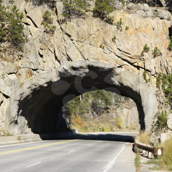 Royalty Free Photo of a Tunnel Going Through Rocks in South Dakota