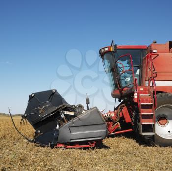 Royalty Free Photo of Side View of Combine Harvesting Soybean Field