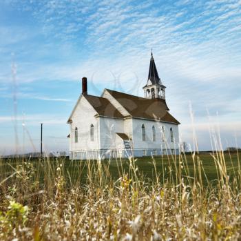 Royalty Free Photo of a Small Rural Church in a Field