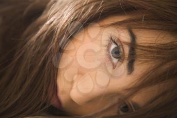 Close up portrait of pretty brunette young Caucasian woman making eye contact.