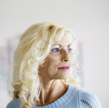 Royalty Free Photo of a Tan Middle-aged Woman Wearing a Lot of Makeup