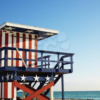 Royalty Free Photo of a Lifeguard Tower Painted Red, White and Blue With Stars and Stripes on a Beach in Miami, Florida, USA