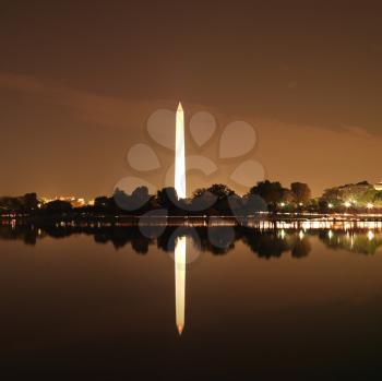 Royalty Free Photo of the Washington Monument Reflected in the Water at Night in Washington, DC, USA