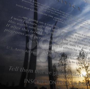 Royalty Free Photo of Three spires of Air Force Memorial Reflected in a Marble Engraved Plaque in Arlington, Virginia, USA