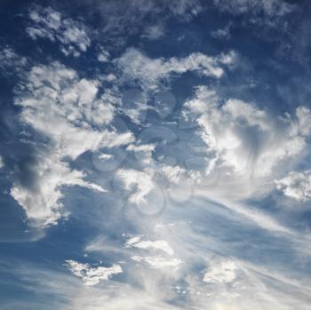 Royalty Free Photo of Wispy Cloud Formations Against a Clear Blue Sky