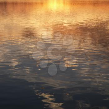 Royalty Free Photo of Reflections of the Sunset on Water